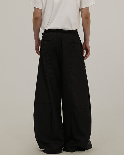 Pantaloni Larghi Uomo Sartoriali con Drappeggio